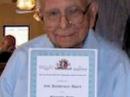 Al Cohen, W1FXQ, with his 80-year QCWA membership certificate.